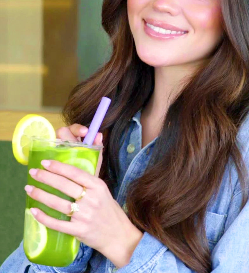 Woman drinking green tea beverage